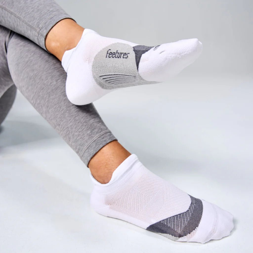 Feetures Elite Light Cushion No Show Tab Socks - White